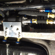 Details of the fuel system components next to the steering rack.